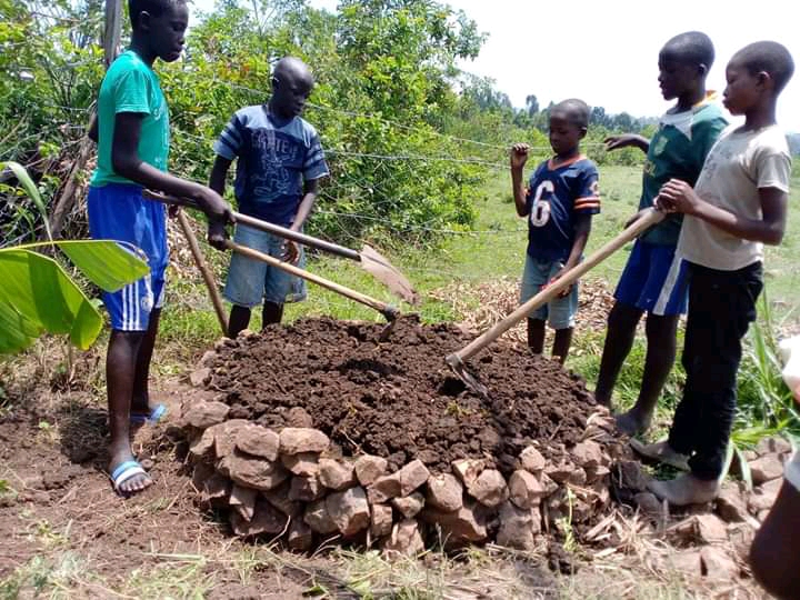 Youth volunteers learn permaculture techniques with Paul and receive gifts of Seeds